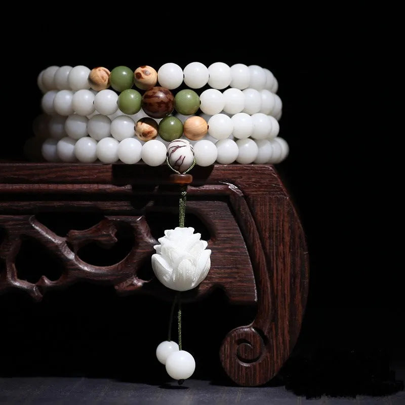 White jade Bodhi bead bracelet with 6x8mm beads in various decorative styles