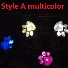 Black solar powered bear paw print garden lights with four paw shapes