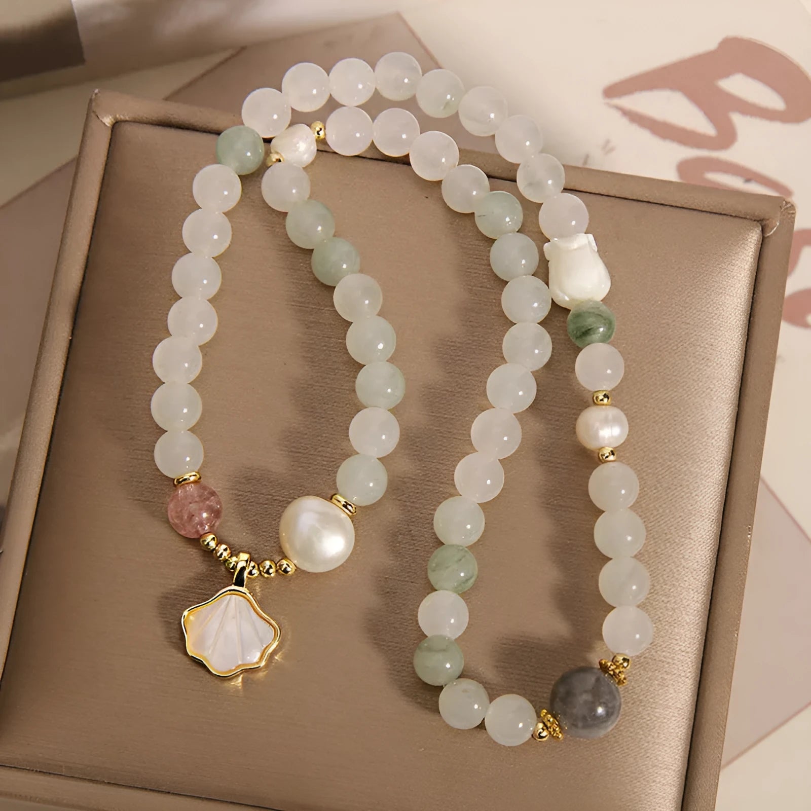 Crystal bracelet with Tianshan jade ginkgo leaf pendant, gold-plated inlay, and rhinestone details