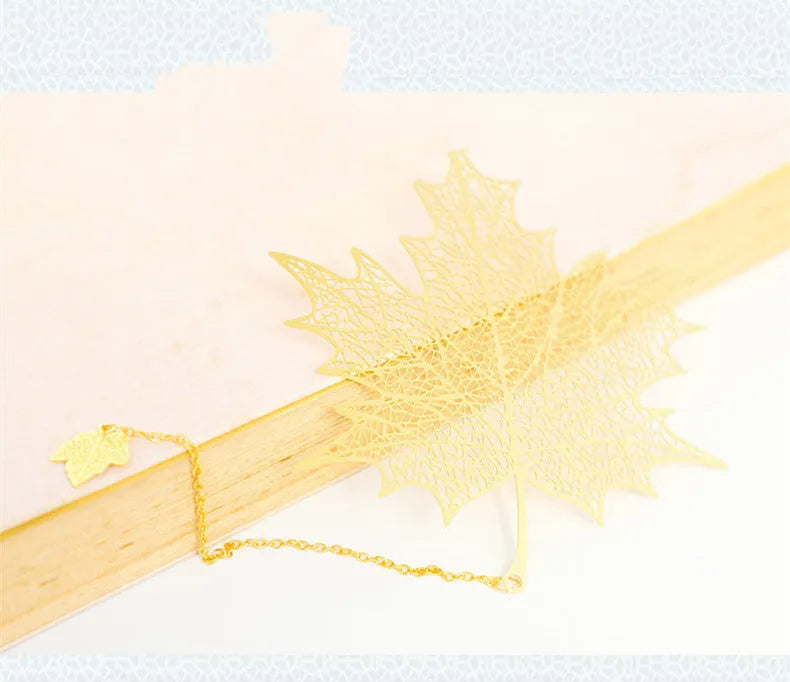Brass metal hollow plated bookmark with leaf design and rose gold tassel