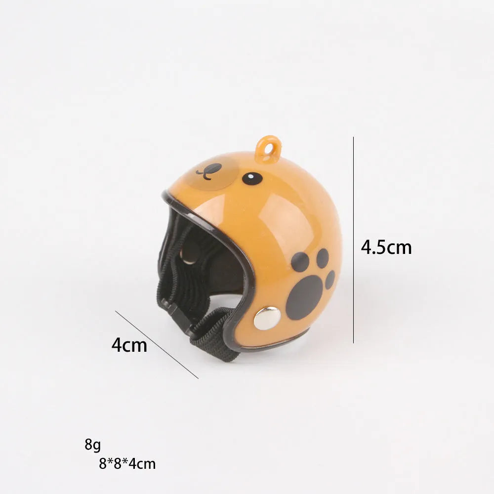 Small hard plastic helmet for chicken or bird with elastic straps and sponge lining.