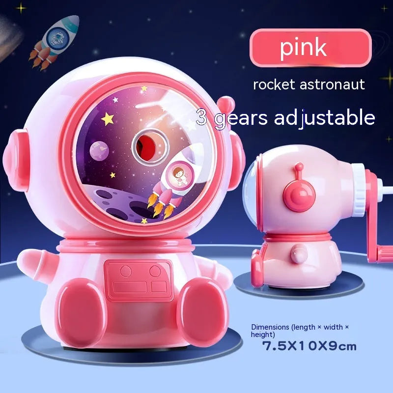 Blue cartoon astronaut manual pencil sharpener for children on a desk