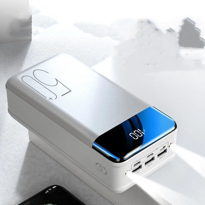 Large 50000 mAh capacity power bank with three USB ports showing black or white colour options