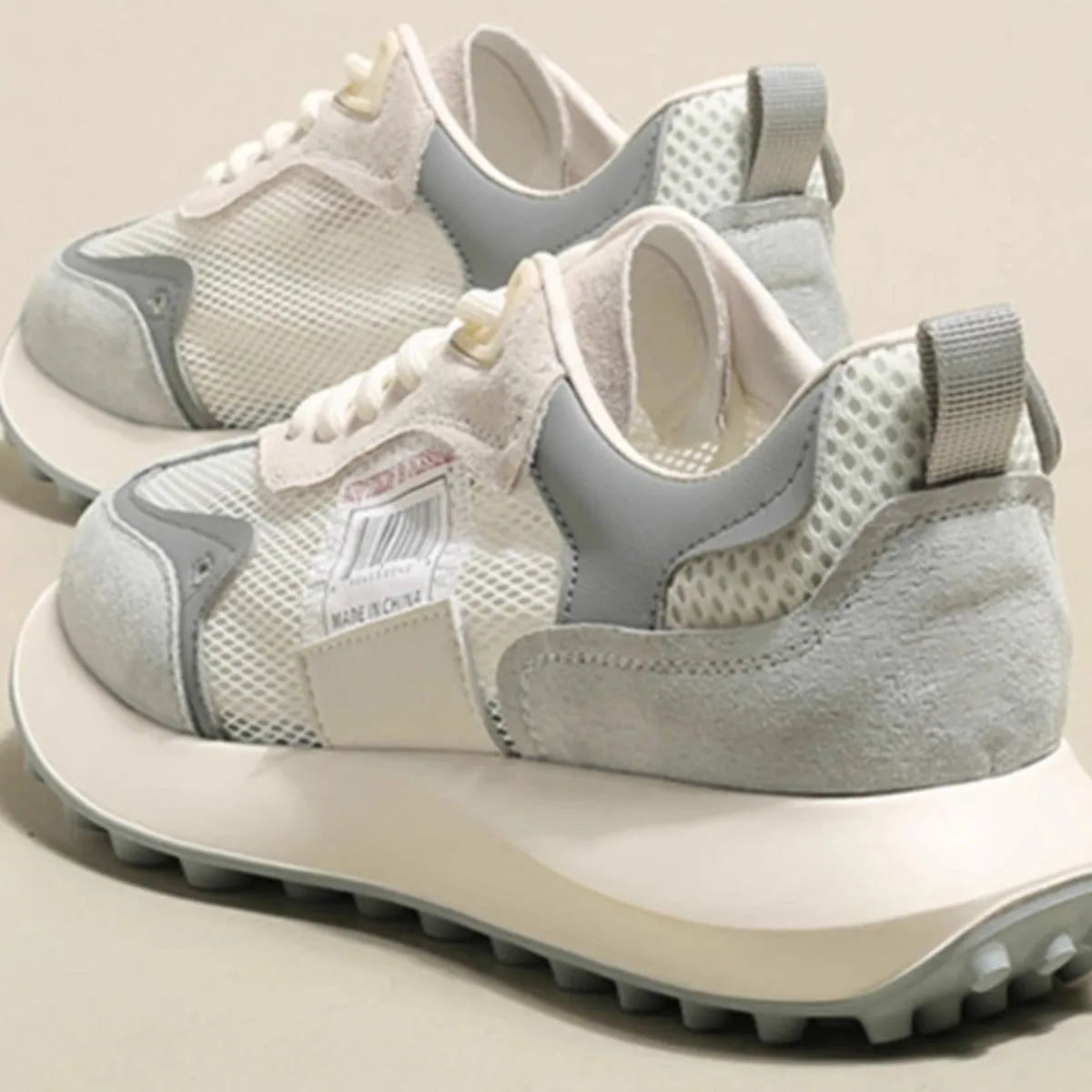 Women's grey and pink retro sneakers with mesh lining and rubber soles in low-top flat heel design