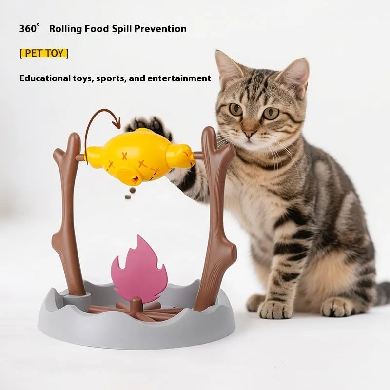 Barbecue style plastic cat toy with tumbling food feeder for treat dispensing.