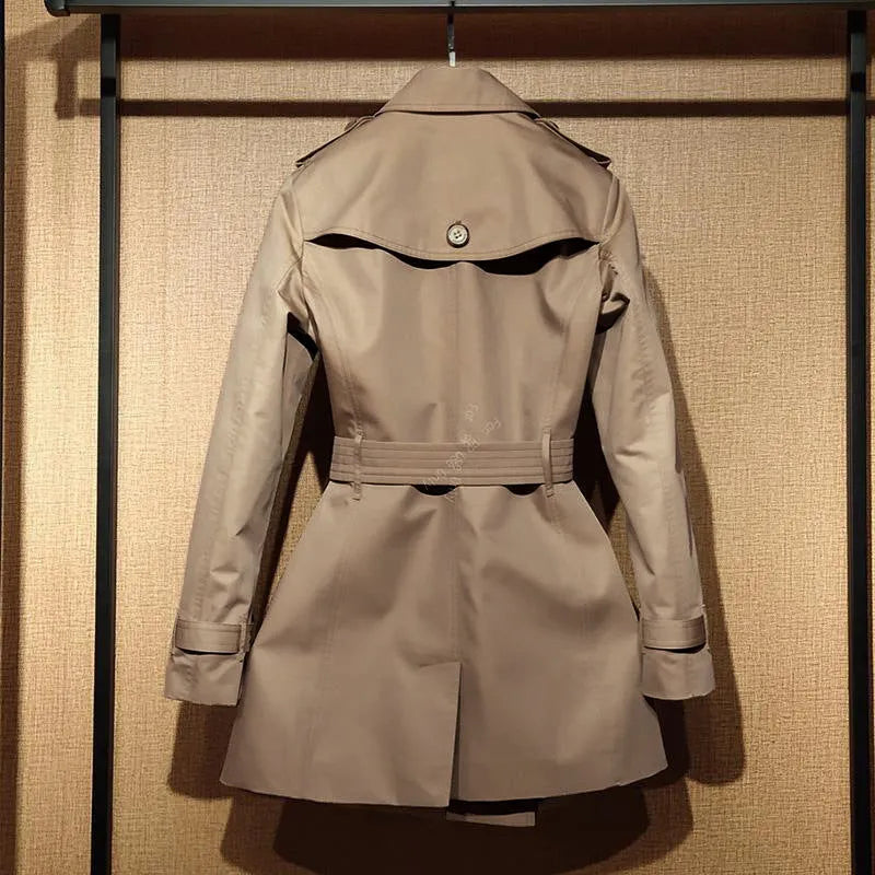 Khaki women's double breasted trench coat with flight sleeves showing button detailing