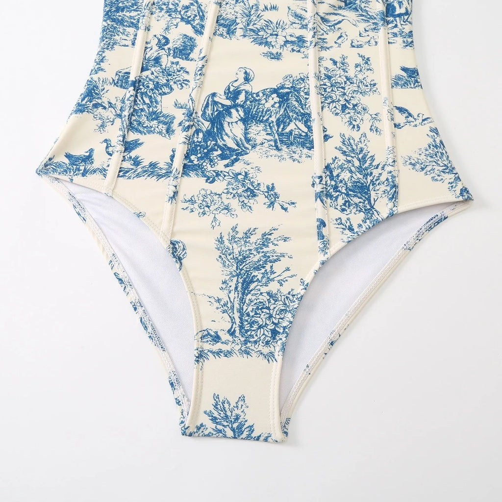 Blue women's one-piece swimsuit with matching gauze skirt on size chart