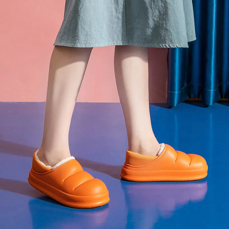 Waterproof EVA garden slippers in green with a plush lining and non-slip sole.