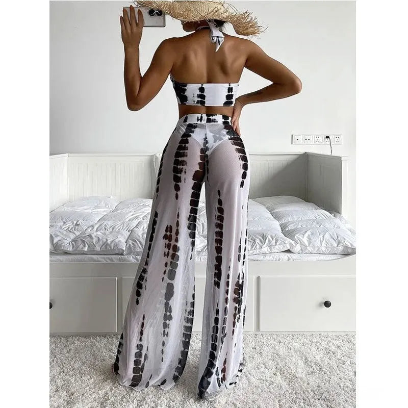Three-piece women's swimsuit set with printed top, bikini underpants, and mesh trousers in blue or black