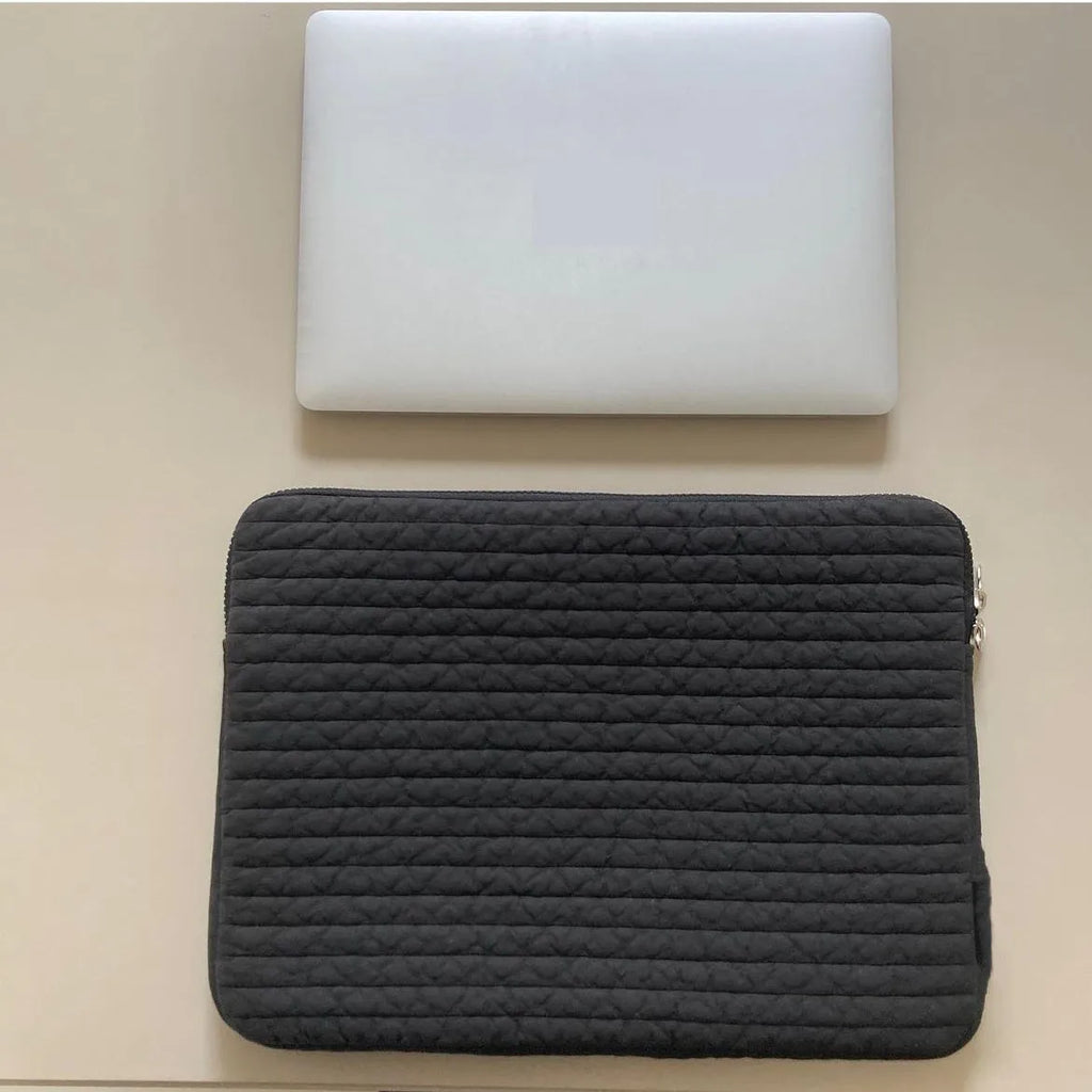 Black and white anti-seismic cotton laptop bag shown in three sizes for tablet protection