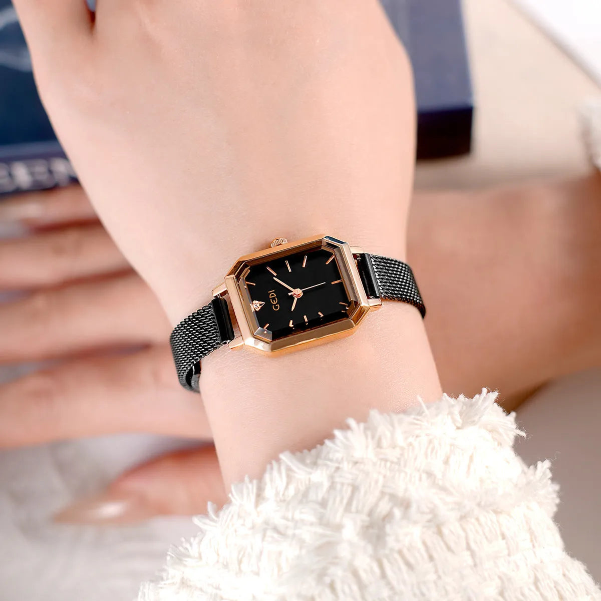 Square retro casual watch for women with rose shell case and choice of coloured dial on wrist.