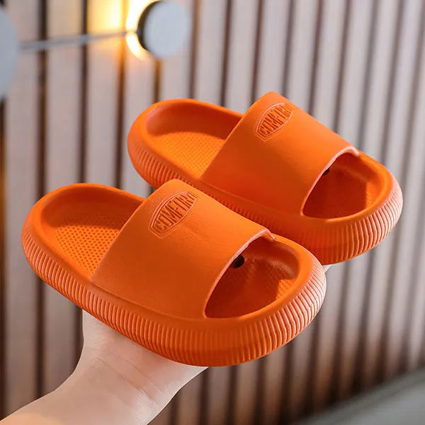Children's mixed colour EVA slippers with non-slip soles showing 1.5cm thickness