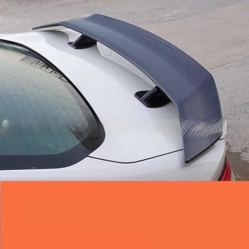 A bright black punch-free ABS plastic tail wing spoiler for cars.