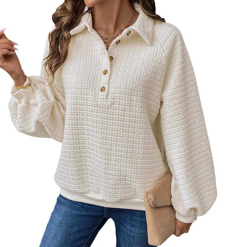 Women's milky white polo collar sweater with long sleeves and textured knit.