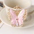 Enamel dripping oil butterfly brooch keychain in pink or blue, dual purpose European style metal accessory.