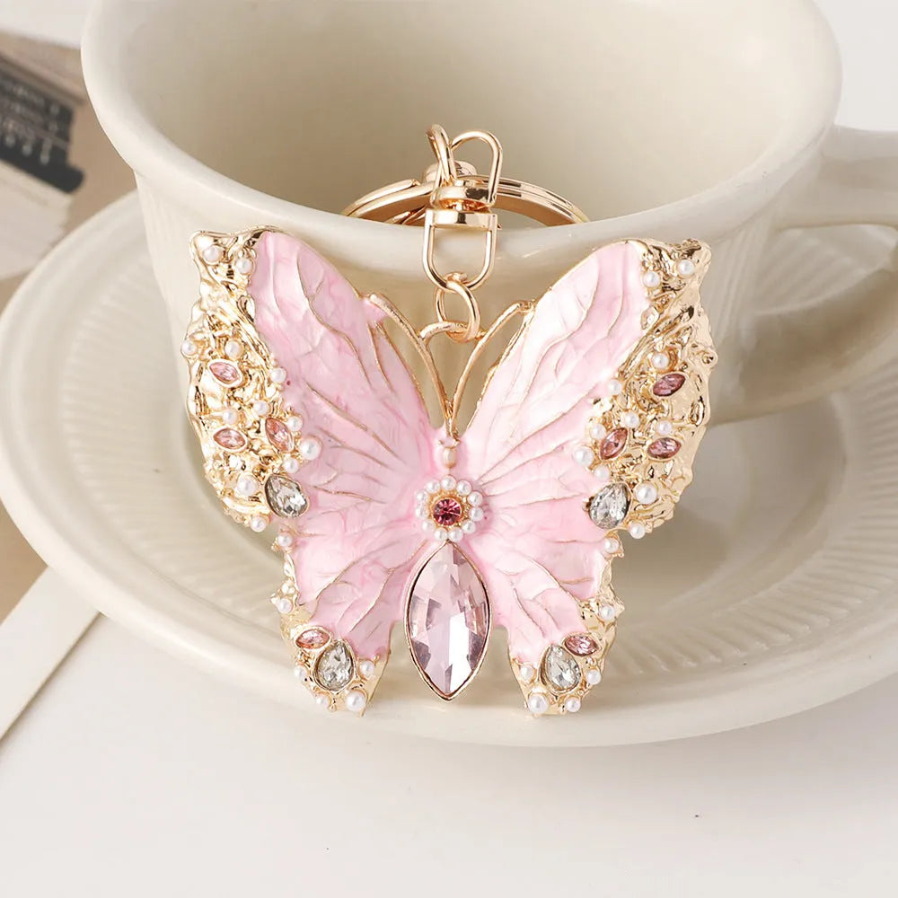 Enamel dripping oil butterfly brooch keychain in pink or blue, dual purpose European style metal accessory.