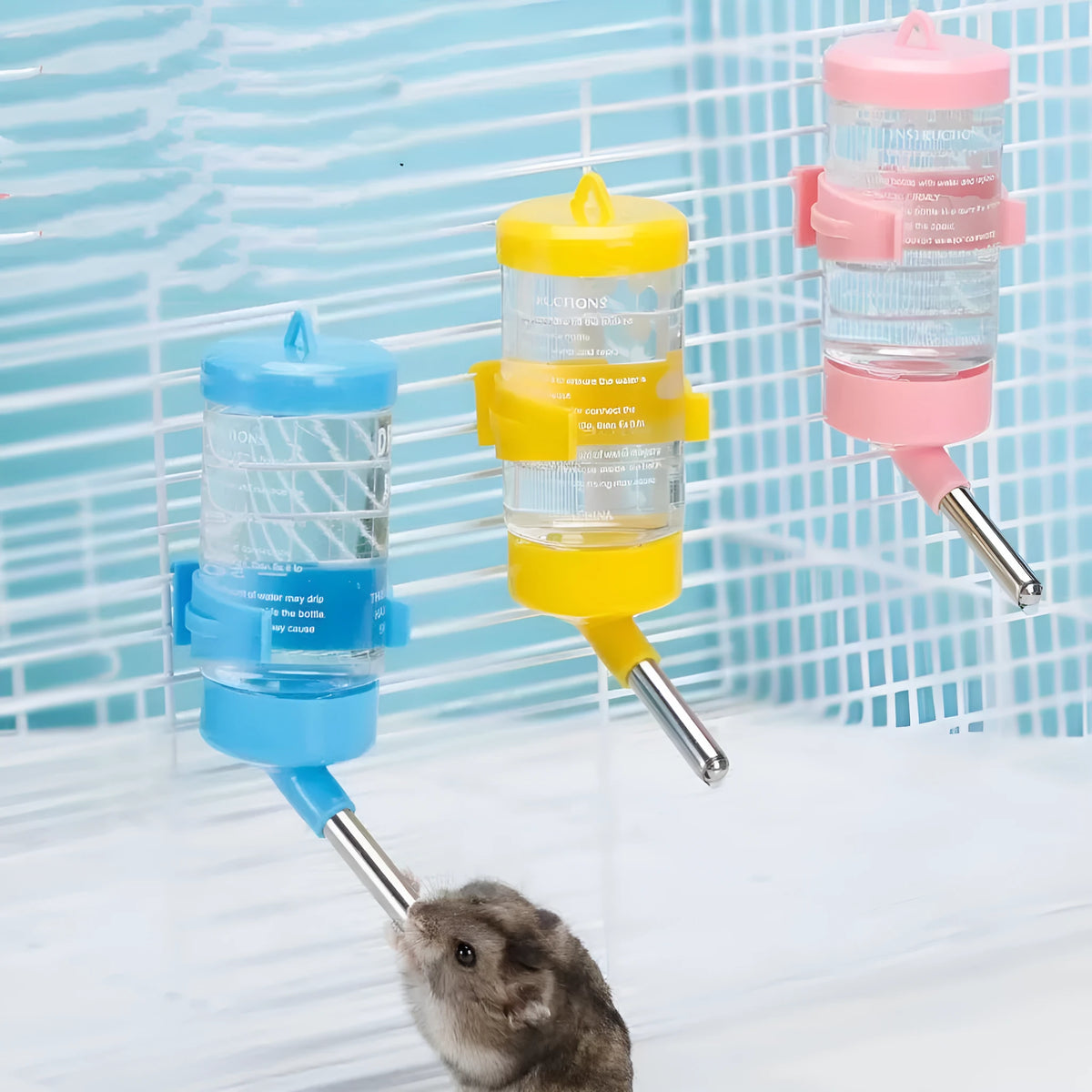 Green plastic leak-proof pet water feeder with ball valve drinking tube attached to cage bars.