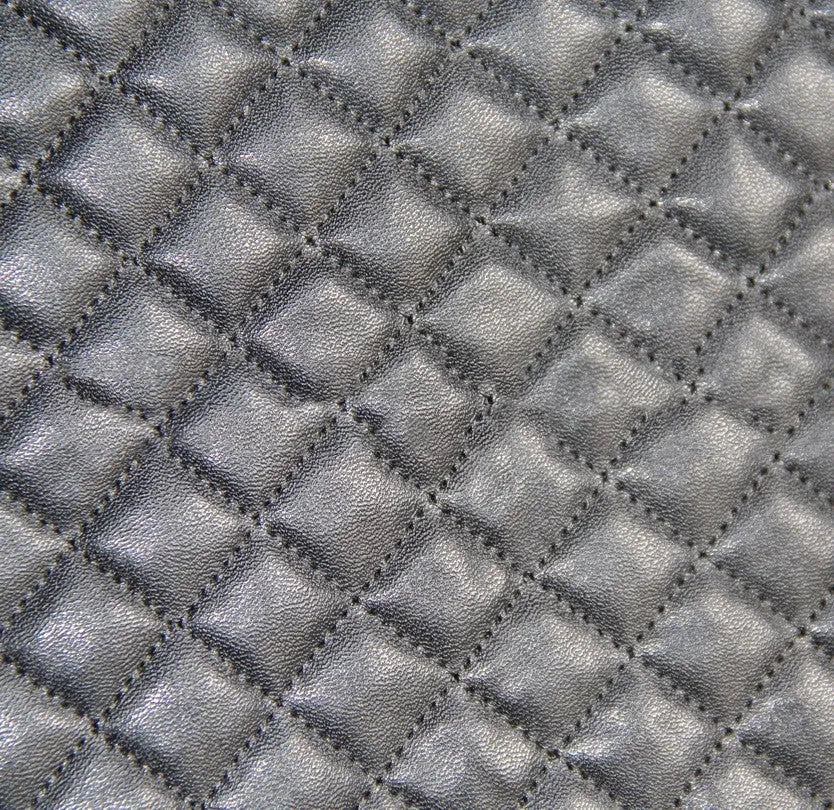 Black quilted car seat cover made of PU and polyester fabric with plastic hooks.