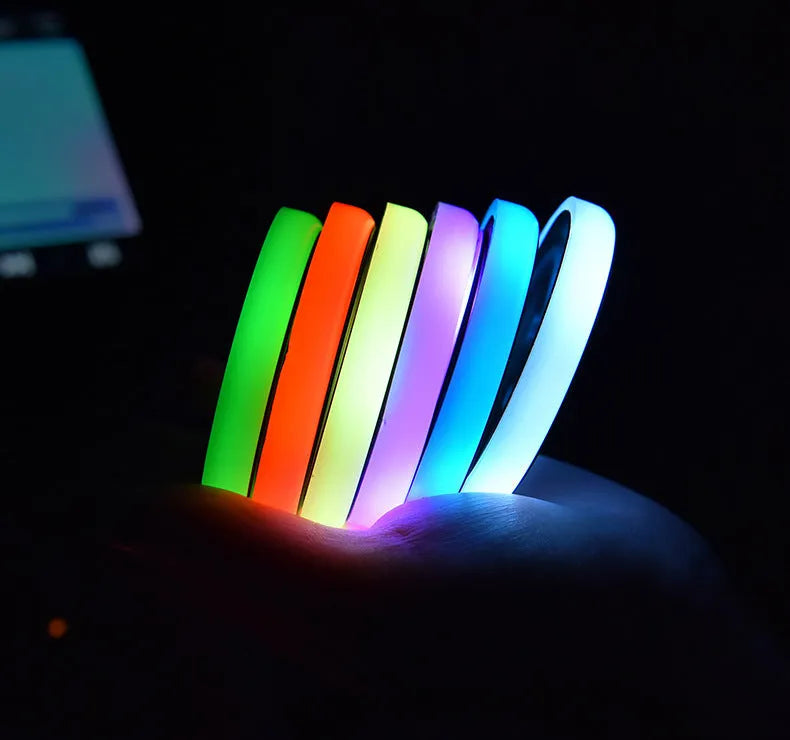 LED light-up cup coaster for cars showing seven colour modes and USB charging cable