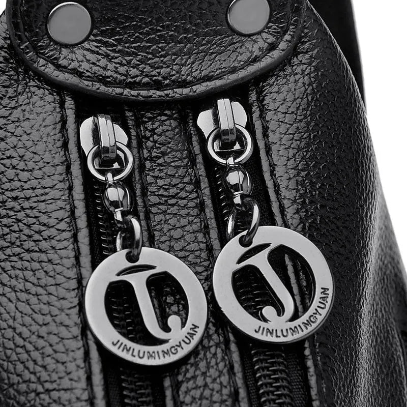 Large black or blue PU crossbody bag with organised internal compartments and soft handle