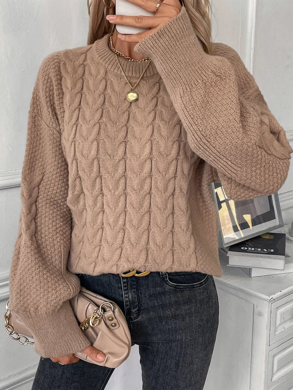 Women's beige round neck casual polyester sweater with loose fit on hanger