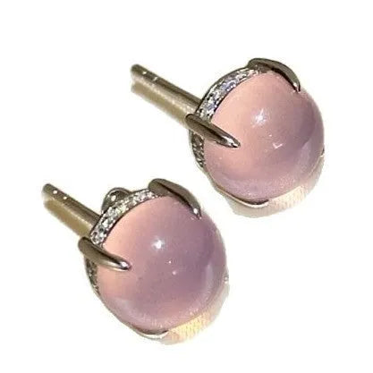 Chinese style chalcedony stud earrings with four-claw stone settings and round geometric design