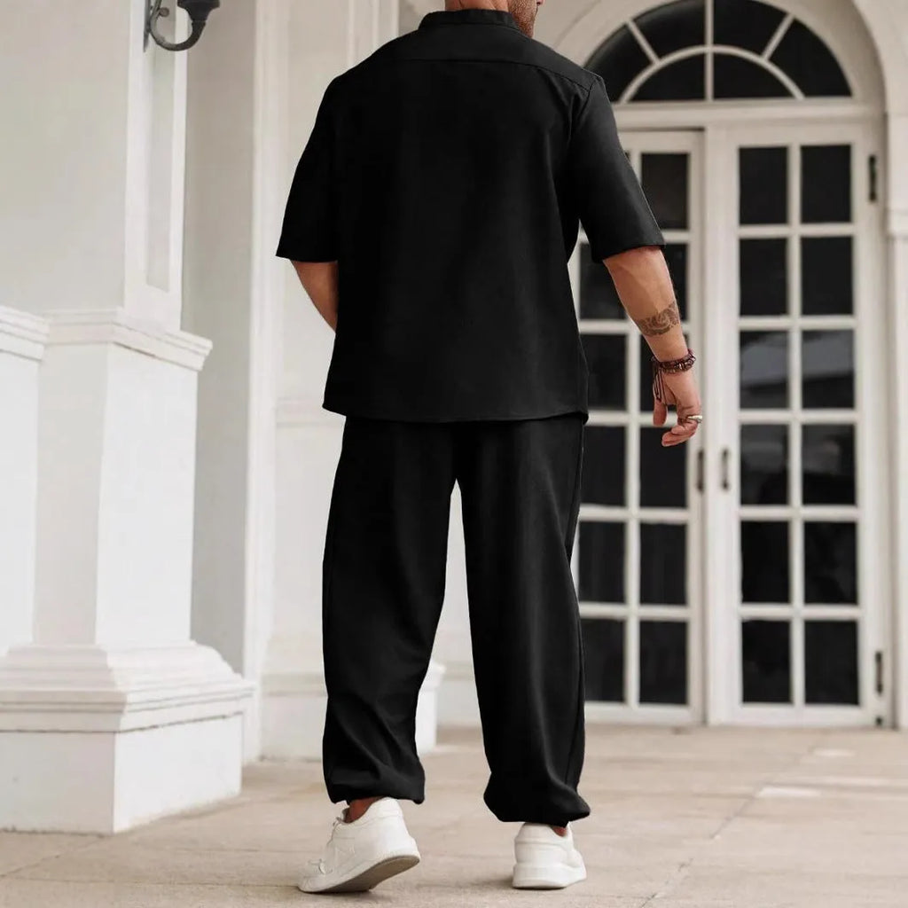 Men's casual apricot-coloured cotton linen short-sleeved shirt and trousers set laid flat.
