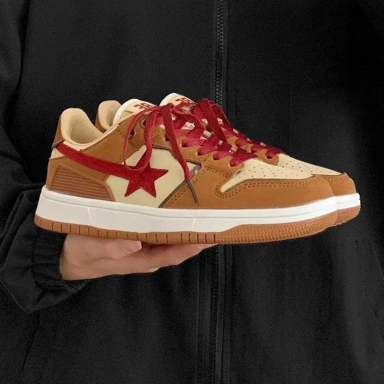 Brown women's low-top sneakers with sequin trim and platform heel on rubber sole.