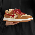 Brown women's low-top sneakers with sequin trim and platform heel on rubber sole.