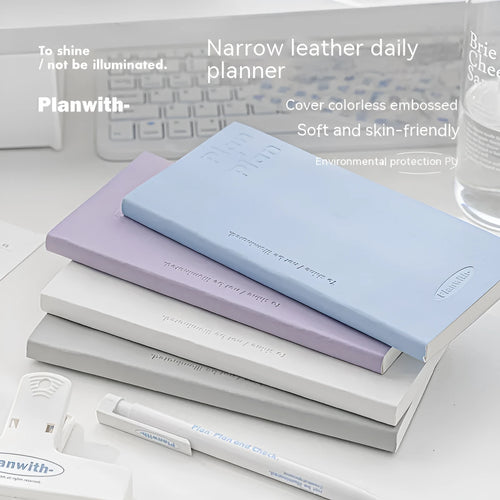 A5 embossed meter notebook open on a desk, showing white 100gsm paper and a choice of five cover colours.