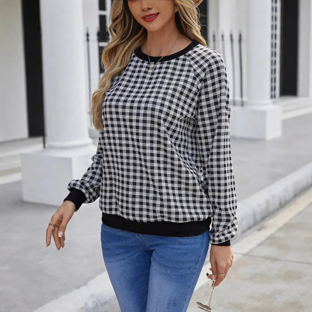 Black plaid pullover sweater with long sleeves and Japanese-inspired printed pattern