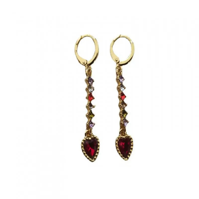A pair of women's heart-shaped alloy earrings with a gold or silver electroplated finish.