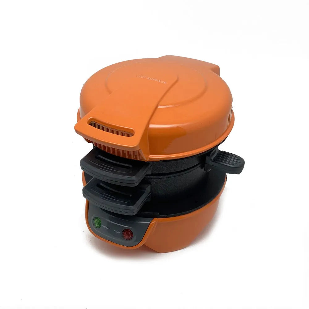Bright red breakfast sandwich maker with egg cooker ring and waffle plates on kitchen counter