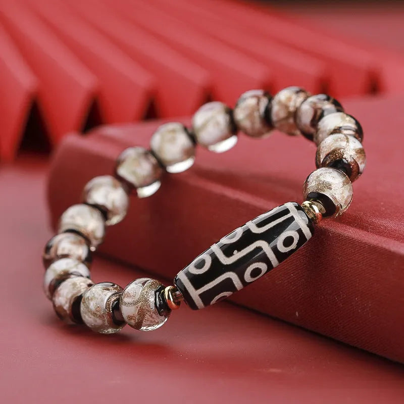 Handcrafted coloured glaze bracelet with Chinese auspicious patterns and snake beads in 10mm, 12mm, or 14mm sizes.