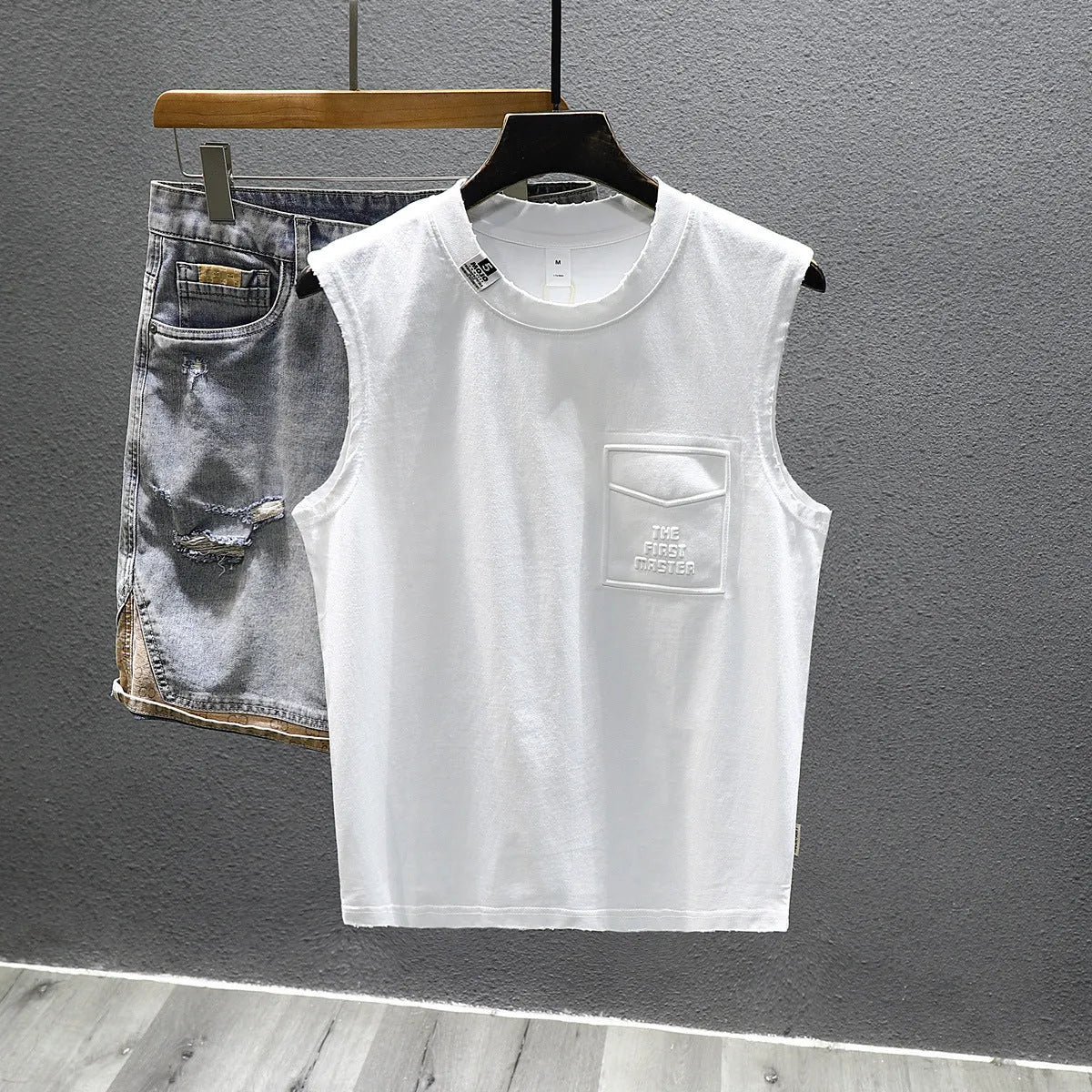 Cotton sleeveless t-shirt in loose fit with straight hem, available in white or black colours