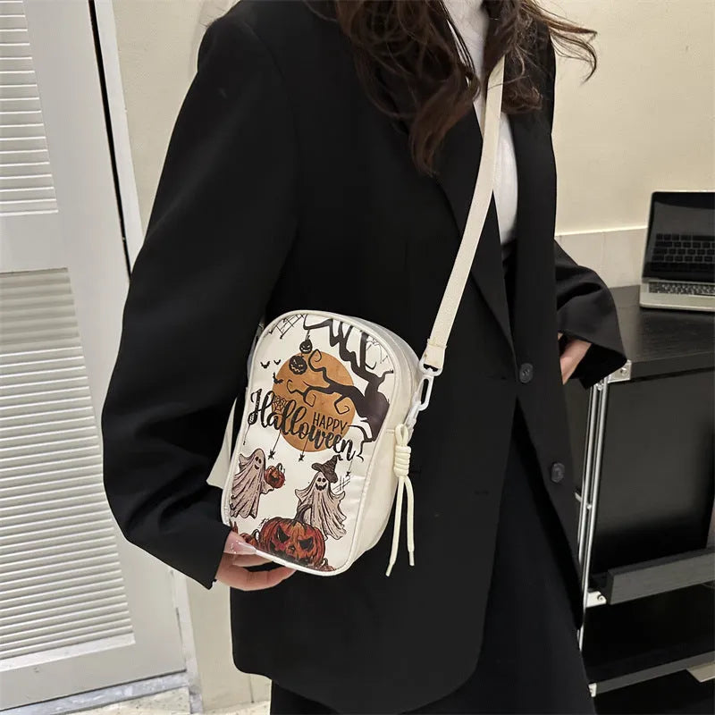Halloween graffiti phone bag with pumpkin ghost bat cartoon print, black colour, crossbody strap.