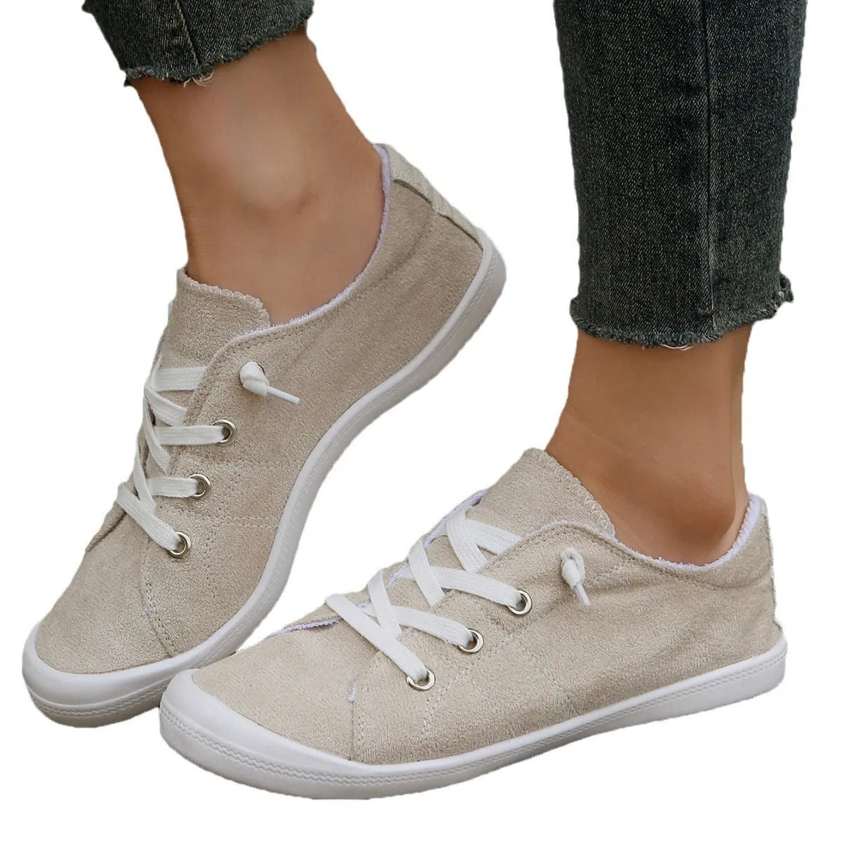 Women's creamy-white casual sneakers with low top fabric upper and rubber sole
