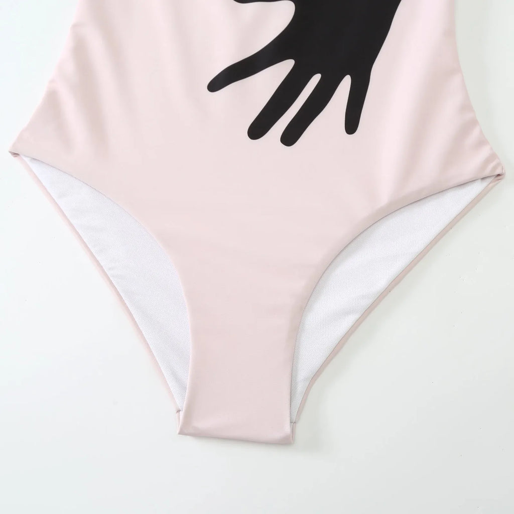 Women's patterned polyester bikini swimsuit with a long attached tulle skirt overlay.