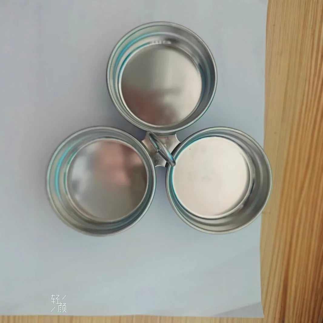 Stainless steel mini heart egg steamer kitchen appliance on countertop