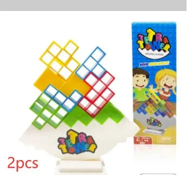 Plastic balance stacking board game with 16 coloured blocks, chassis, and base on a table