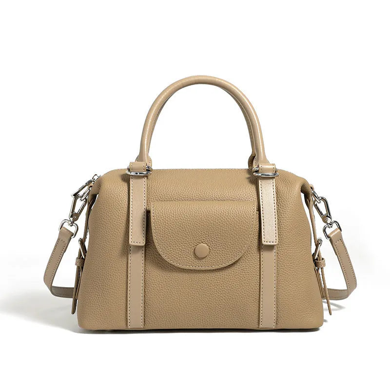Genuine leather ladies shoulder bag in street trend style with lock detail and contrast stitching.