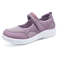 Women's low-top casual sneaker in grey mesh with velcro strap and flat polyurethane sole.
