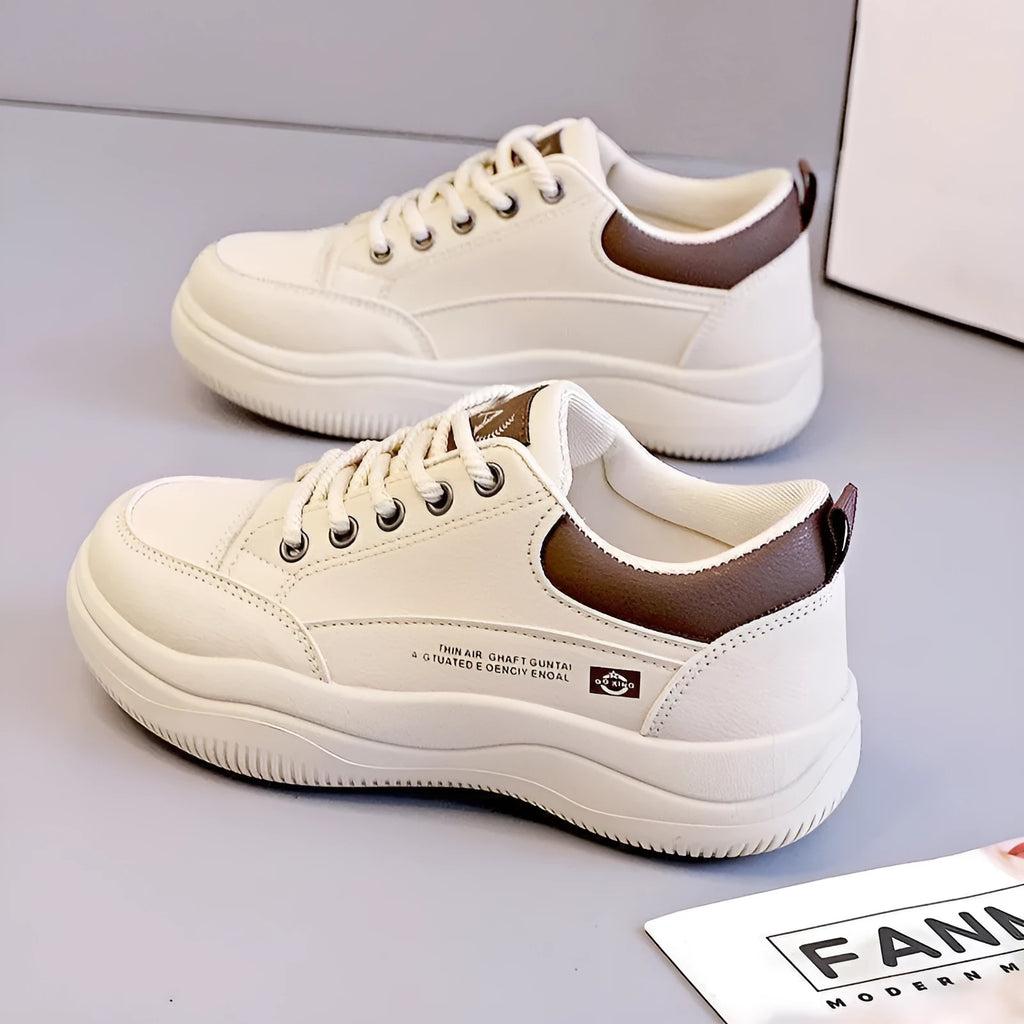 Women's white Korean-style low-top lace-up pumps with cross straps and a round toe.