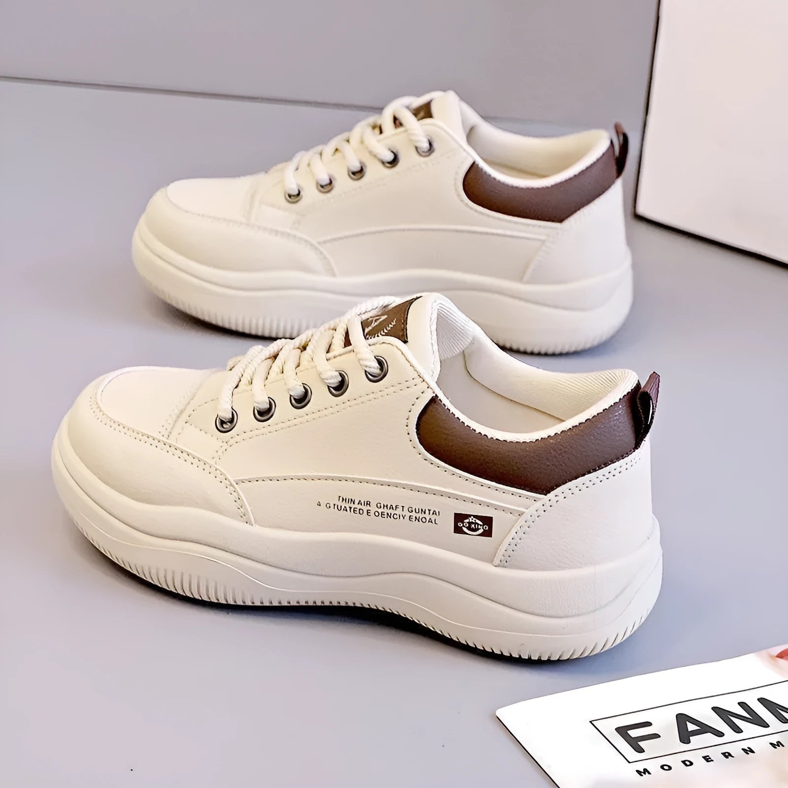 Women's white Korean-style low-top lace-up pumps with cross straps and a round toe.