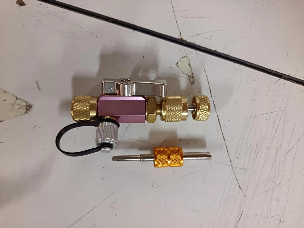 Vacuum valve core disassembly tool set showing four style options with black and pink valve removers