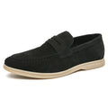 Men's beige leather slip-on casual shoes with a round toe and rubber sole on a neutral background.