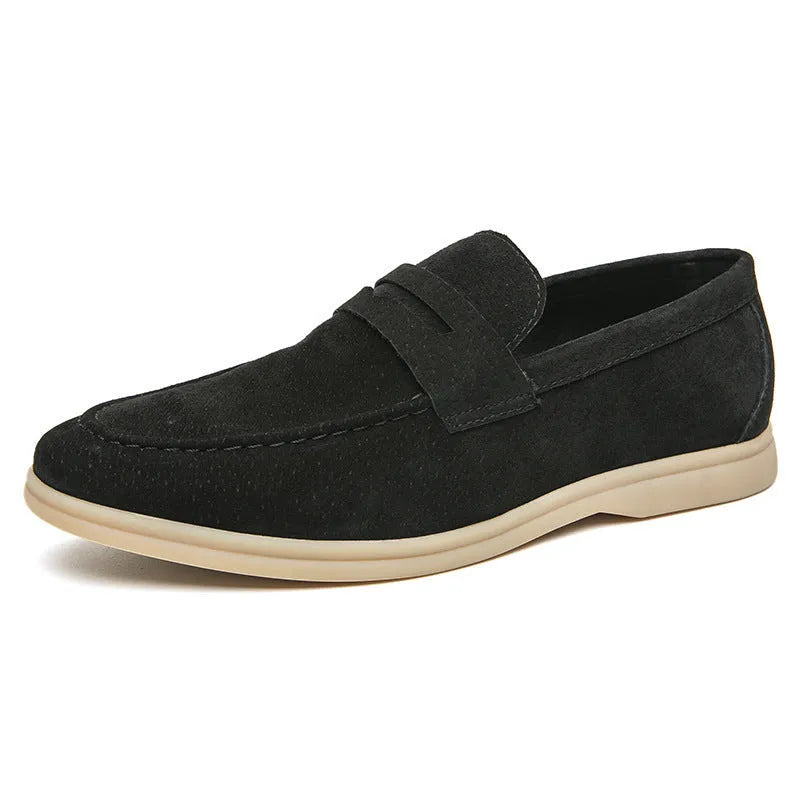 Men's beige leather slip-on casual shoes with a round toe and rubber sole on a neutral background.