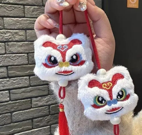 Blue and yellow handmade plush cartoon lion keychain with long tassel and star stone decoration.