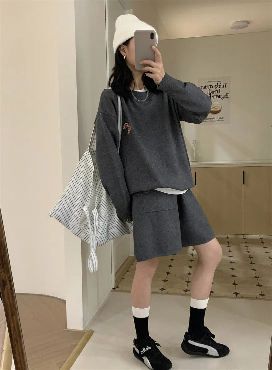 Women's milk blue knitted sweater and shorts loungewear set with embroidered animal pattern.