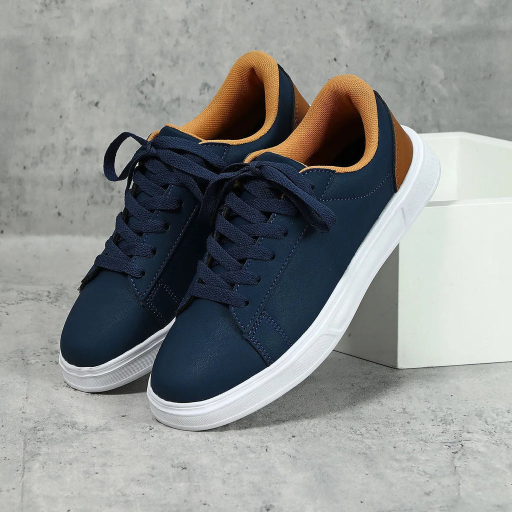 Women's platform skateboard sneakers with cross-strap detailing and mid-heel sole